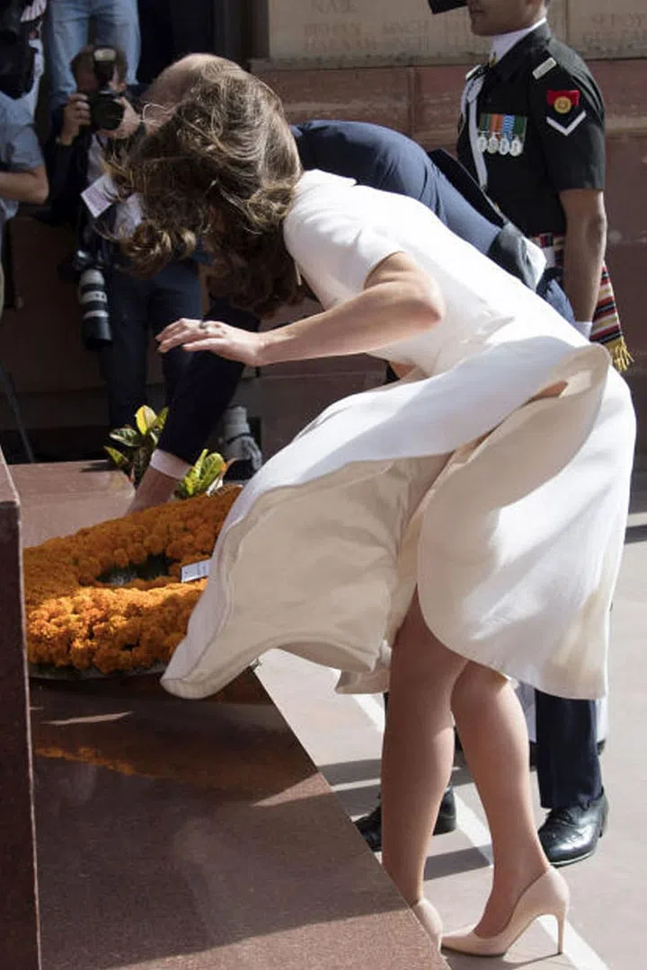 GOING MARILYN MONROE
In her most painful wardrobe malfunction to date, Kate's cream dress flew up while she was placing a wreath at a war memorial in Delhi, India. Photo: Getty