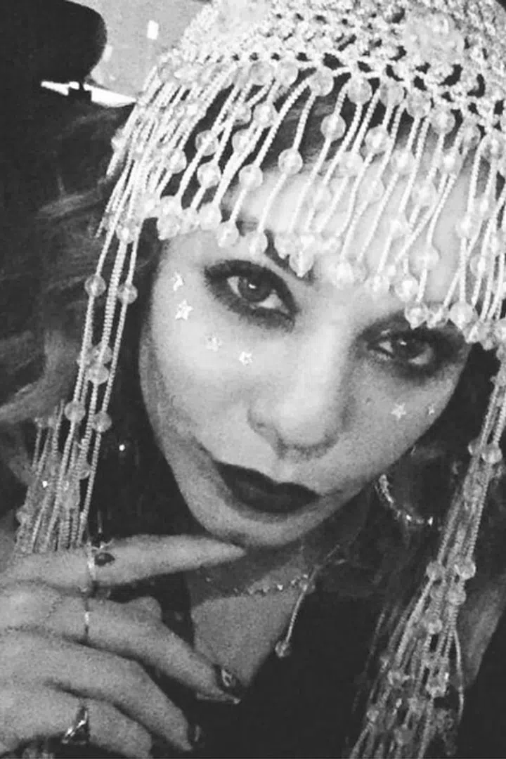 The actress dressed as a fortune teller. 