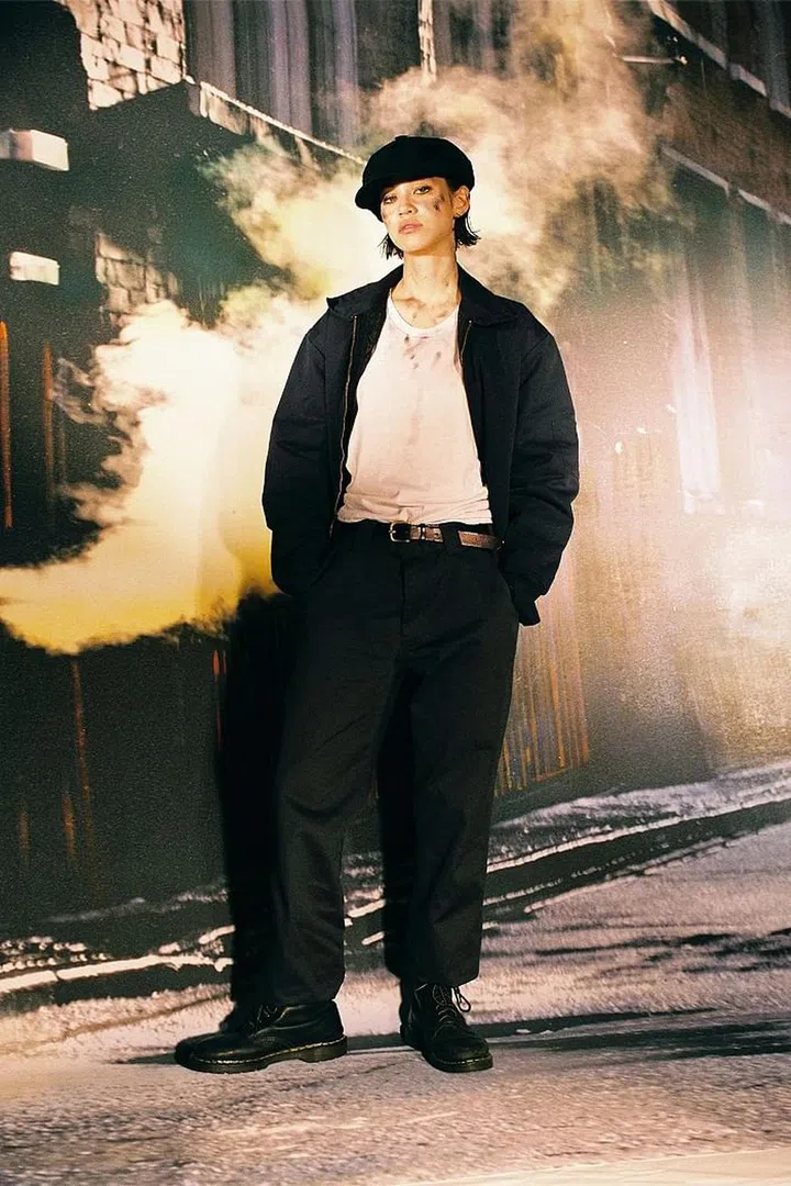 Paired with chinos pants, a model wears a pair of Dr. Martens, the British boot brand that first launched in 1960. The leather boots became a staple during the grunge era in the 1990s for both men and women. Photo: MOMA