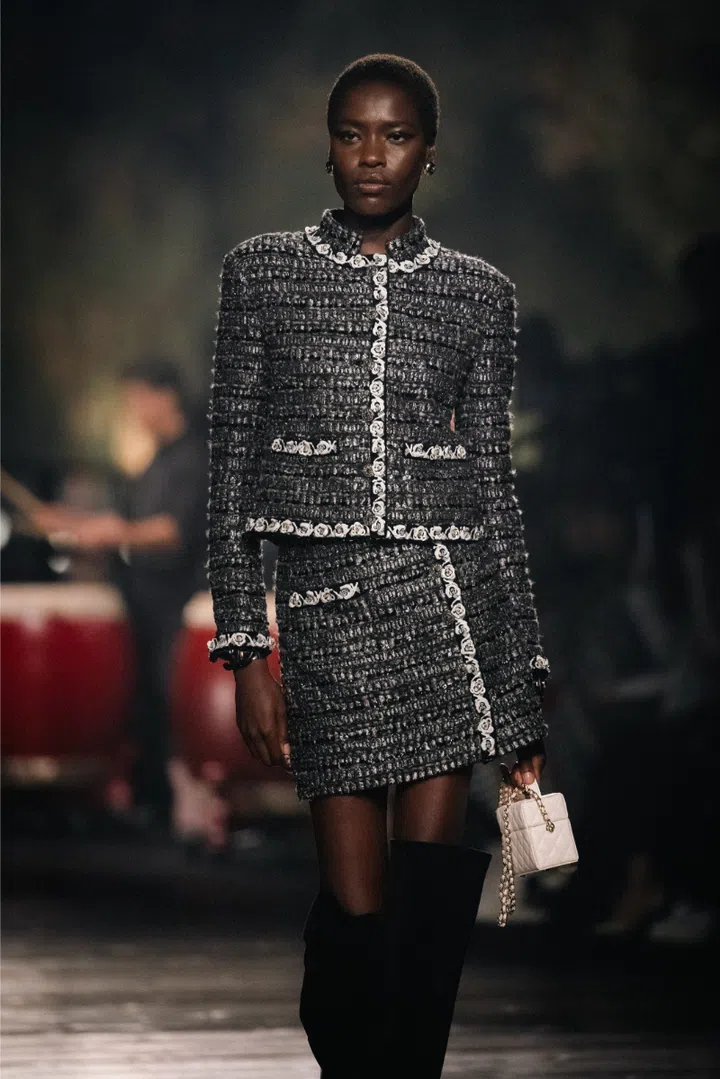 Model in a glittery sequined Chanel outfit