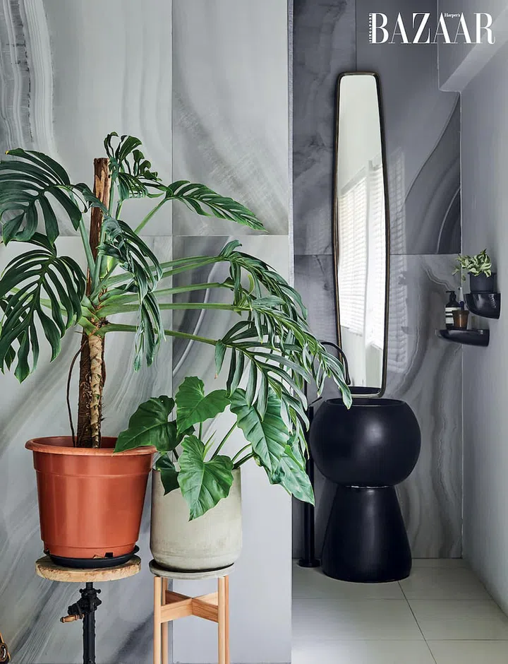 Tan, who is co-founder of plant project The Botanist And Her Thieves, uses greenery to accentuate various spaces such as the minimalist bathroom.