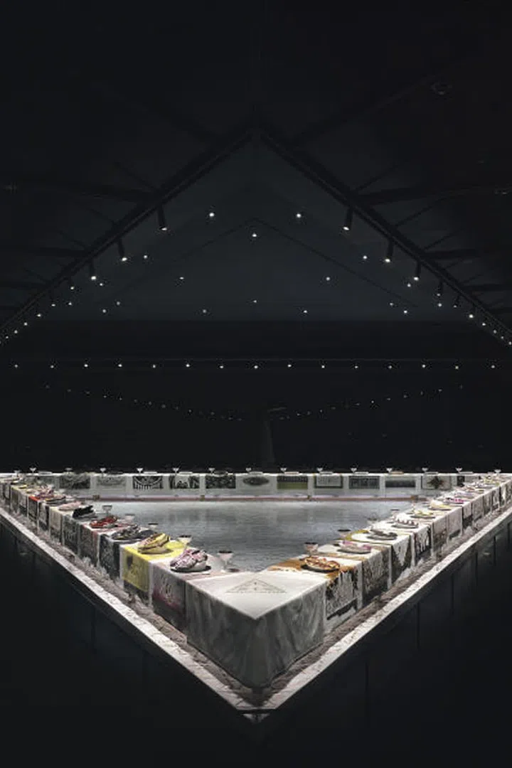 With her own homage to the notable women of history, feminist artist, author and educator Judy Chicago went considerably further back in time than late 18th-century Paris. In The Dinner Party from 1974-1979, Chicago produced an iconic installation commemorating 1,038 women in history, with embroidered entry banners, an engraved floor and a massive triangular banquet table of place settings for 39 women, with guests ranging from the Primordial Goddess to Georgia O'Keeffe. Currently housed in the Sackler Center at the Brooklyn Museum, the installation is a centerpiece of feminist art, produced during a pivotal period in the 1970s when female artists tackled issues of gender head-on.
Pictured: The Dinner Party, 1974-1979, Brooklyn Museum