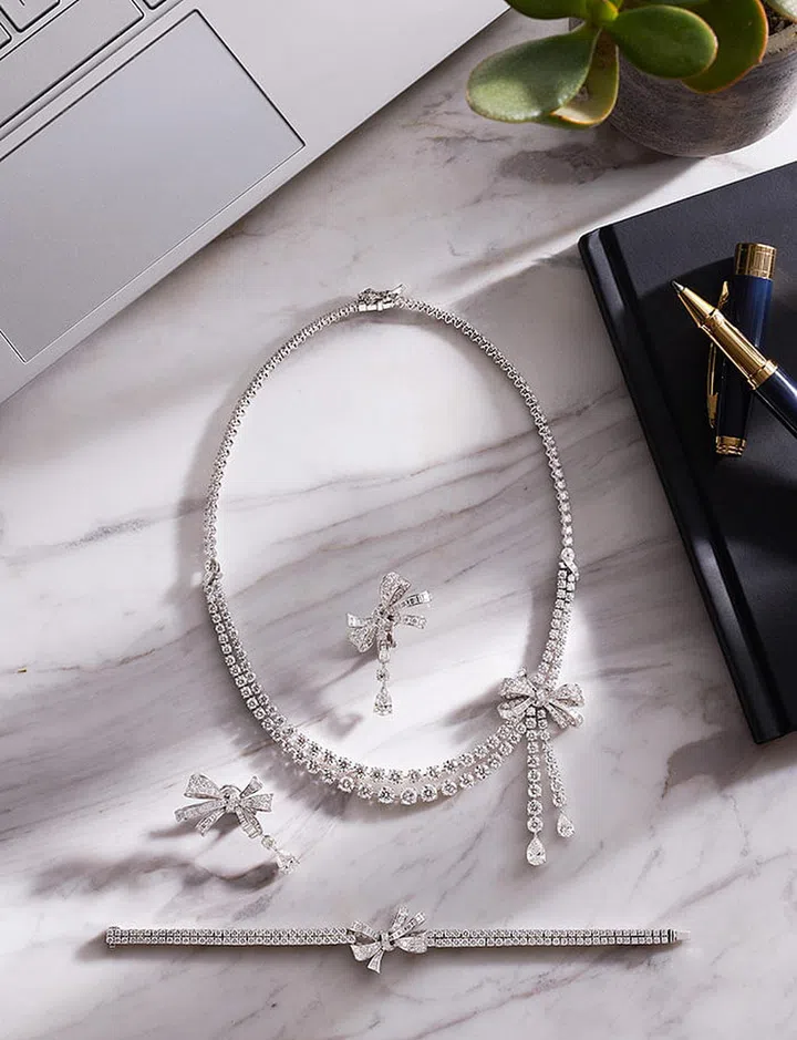 From top: GRAFF Bow Collection multi-shaped diamond necklace (29.60 carats); multi-shaped diamond earrings (6.23 carats); multi-shaped diamond bracelet (7.08 carats).