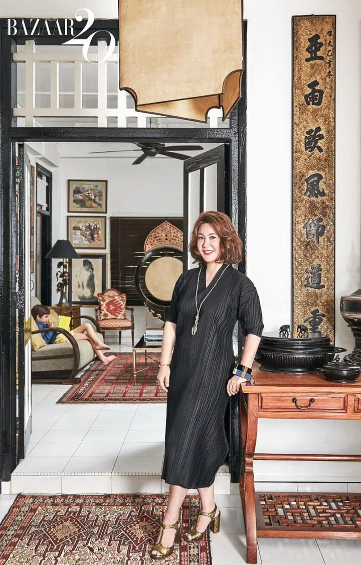 Desmazieres livens up her Pleats Please Issey Miyake dress with gold heels and chunky jewellery.

(Photo: Phyllicia Wang)
