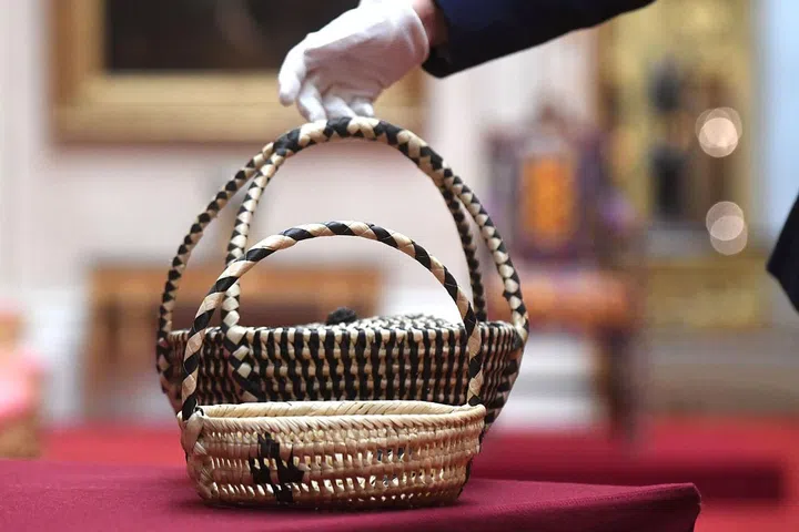 A pair of baskets woven from coconut leaves was presented to The Queen by Queen Salote Tupou of Tonga during her Commonwealth visit in 1953. Photo: Getty