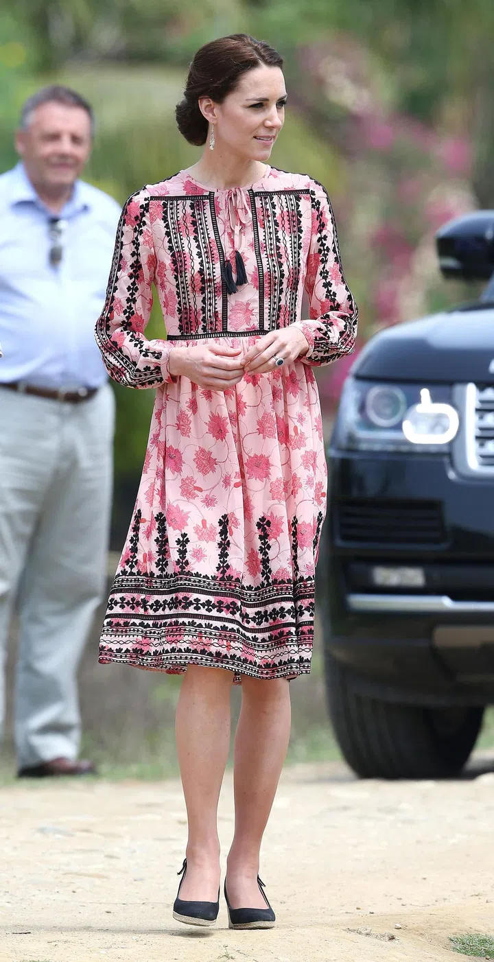 Middleton sported a pink floral dress with black details by Topshop as she visited the Centre for Wildlife Rehabilitation and Conservation (CWRC) at Panbari reserve forest in Kaziranga to feed baby elephants.