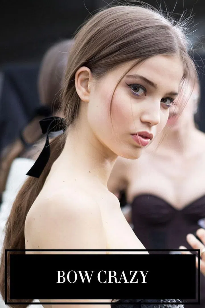 We survived 2016—we know to expect to unexpected. Yet we were still surprised when black ribbon and bows became the runaway hair trend in New York, London, Milan, and Paris. At Philosophy di Lorenzo Serafini (left), hair was pulled back into a low ponytail and topped with a coquettish bow. Wrapped in silk, velvet, tied in a ponytail or looped above a bun, the runways proved this season that there's more than one way to wear the ribbon trend.