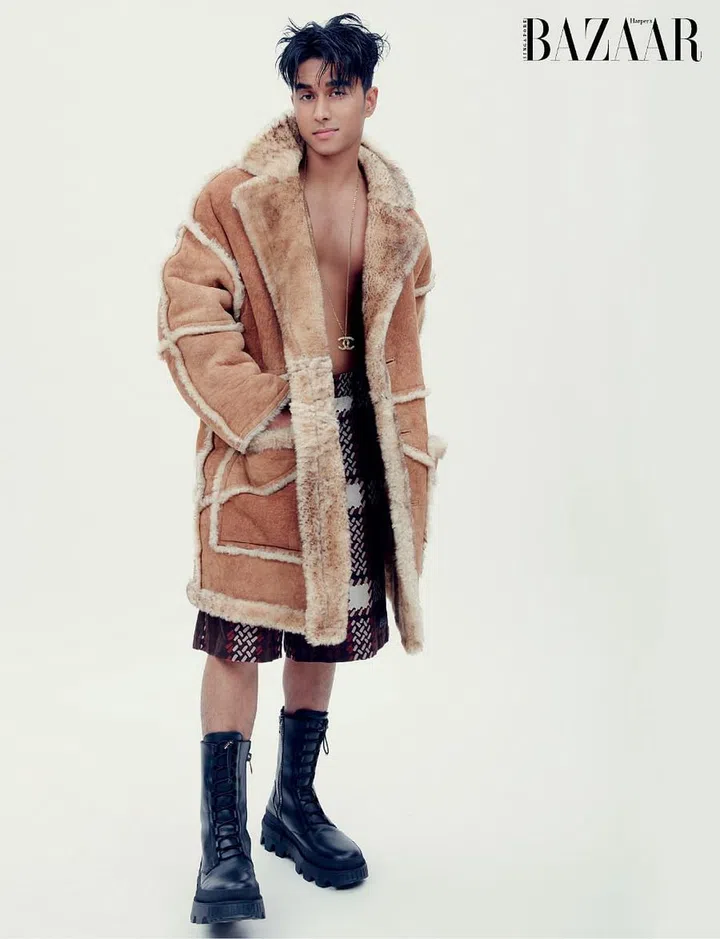 Coat; shorts, Coach. Boots, Moncler. Necklace, stylist’s own.