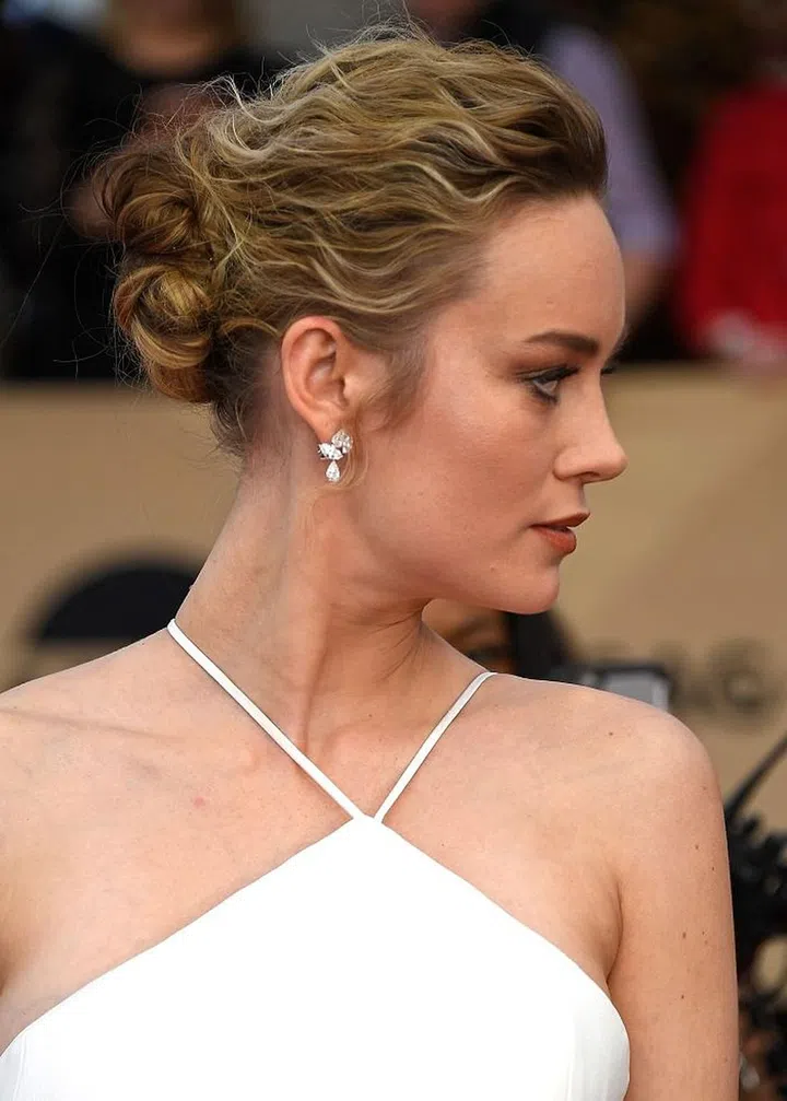Brie Larson's fuzzy chignon is the perfect way to embrace your natural curl texture. Photo: Getty 