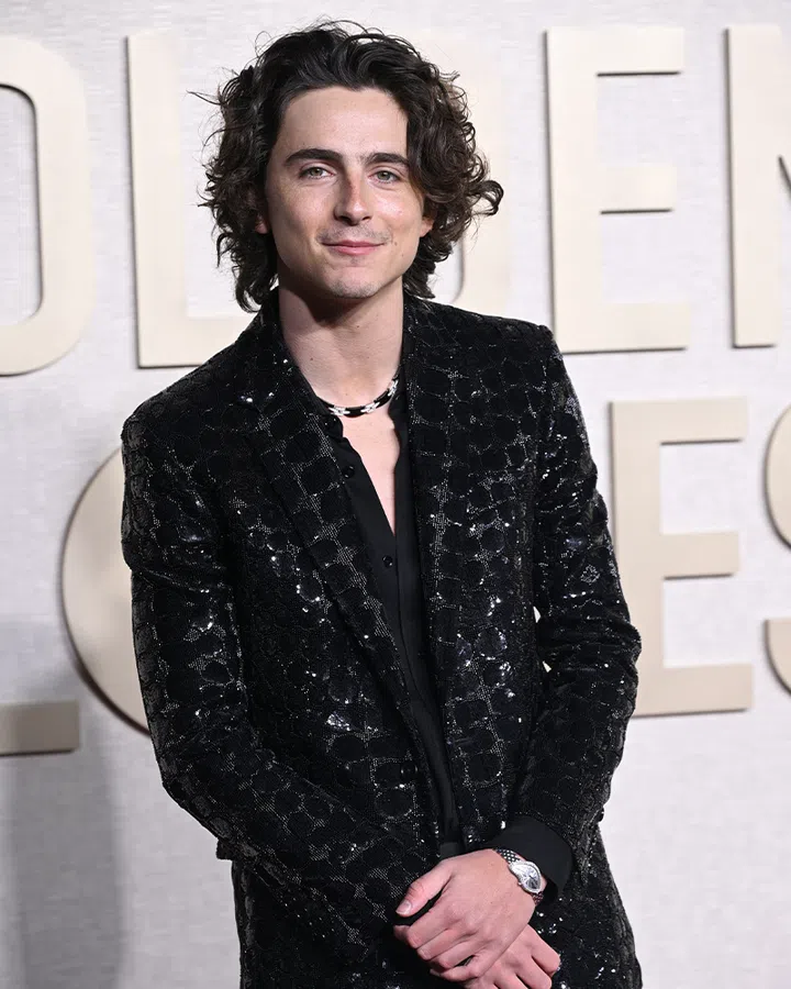 trends from the past watches and jewellery | timothee chalamet wearing a black suit and a vintage cartier crash at the 2024 golden globes