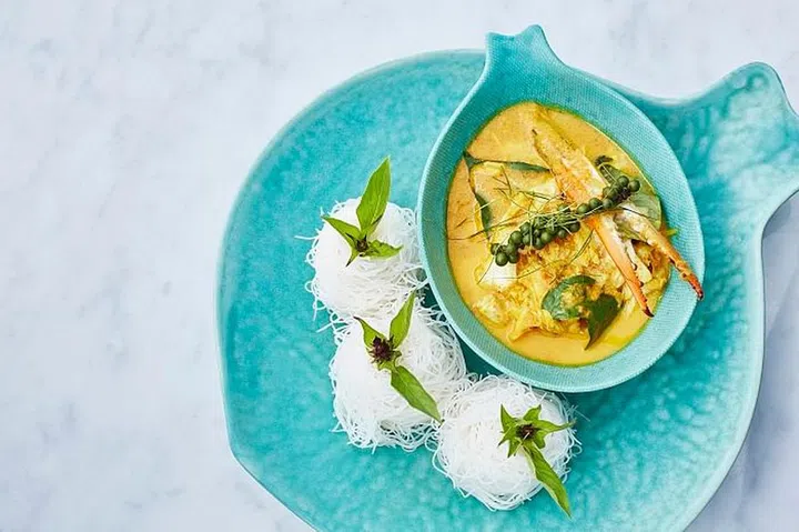 Fresh turmeric and coconut curry with local blue crab, young ginger and betel leaf from 