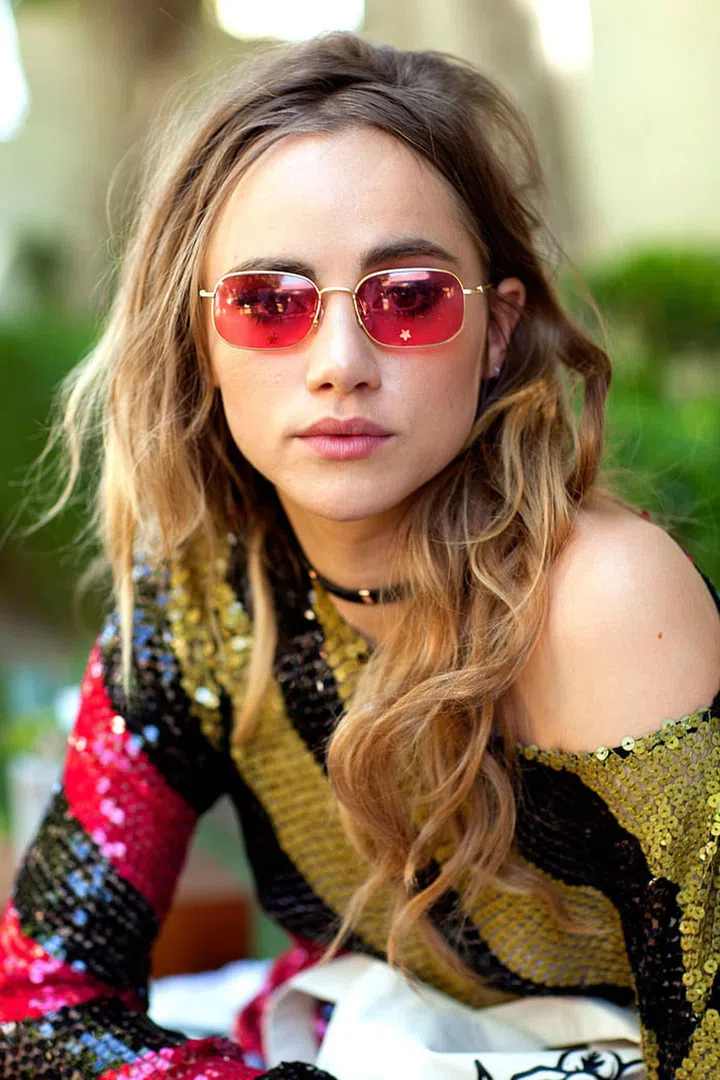 For Coachella, Suki Waterhouse went for an all-out hippy feel in sparkly Sonia Rykiel and retro red sunglasses. Photo: Getty 
