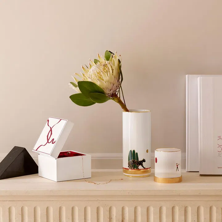 (From left) Entrelacés de Cartier lacquered wood jewellery box; Panthère de Cartier porcelain vase; Diabolo de Cartier porcelain candle holder