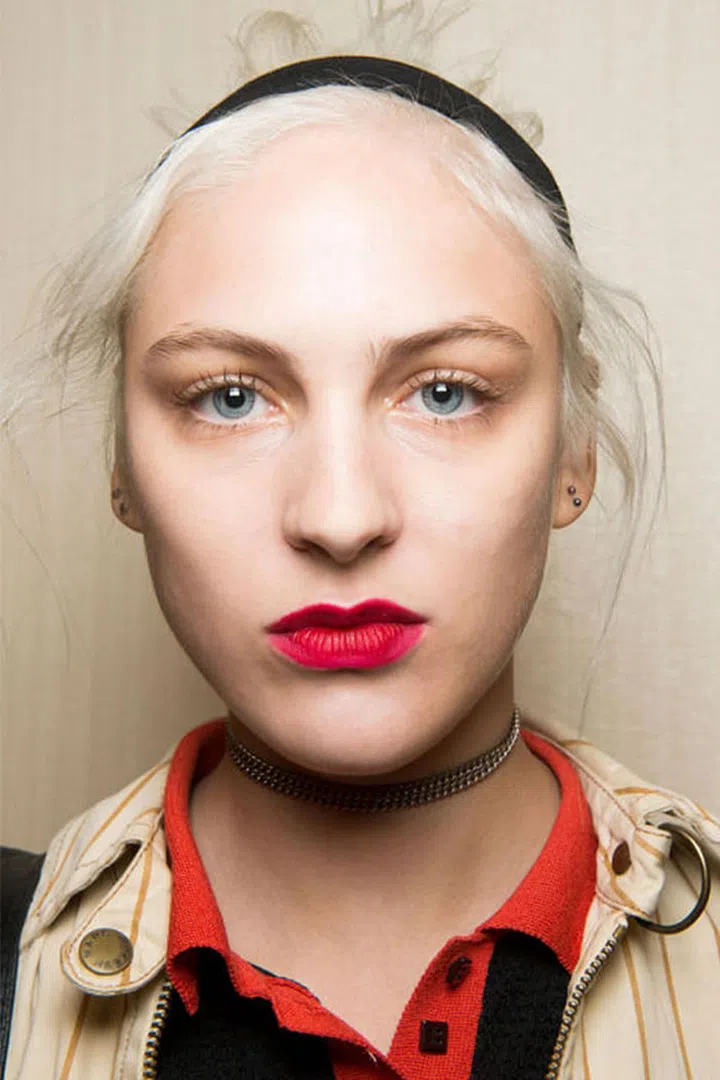 The Look: The Newish Matte Lip
How-To: In the days before matte lipsticks were rolling around in the bags of basically every woman everywhere, makeup artists had to improvise. They powdered, blotted, and then re-powdered creamy lipsticks to create that velvety finish. It was this backstage trick that makeup artist Mark Carrasquillo recalled when he created the look at Creatures of the Wind. Except this time, the powder itself was the statement. After applying (and yes, blotting down) Nars Velvet Matte Lip Pencil in Dragon Girl, Carrasquillo dipped a fluffy brush in Nars blush in Exhibit A and dusted it all over the lips. Sweep after sweep, the electric fuchsia brought a dimension of color and texture to the lipstick impossible to achieve on its own. And other than making one hell of a statement, there's also this: you can rest assured knowing this lip look will not budge.
Photo: IMAXTREE
