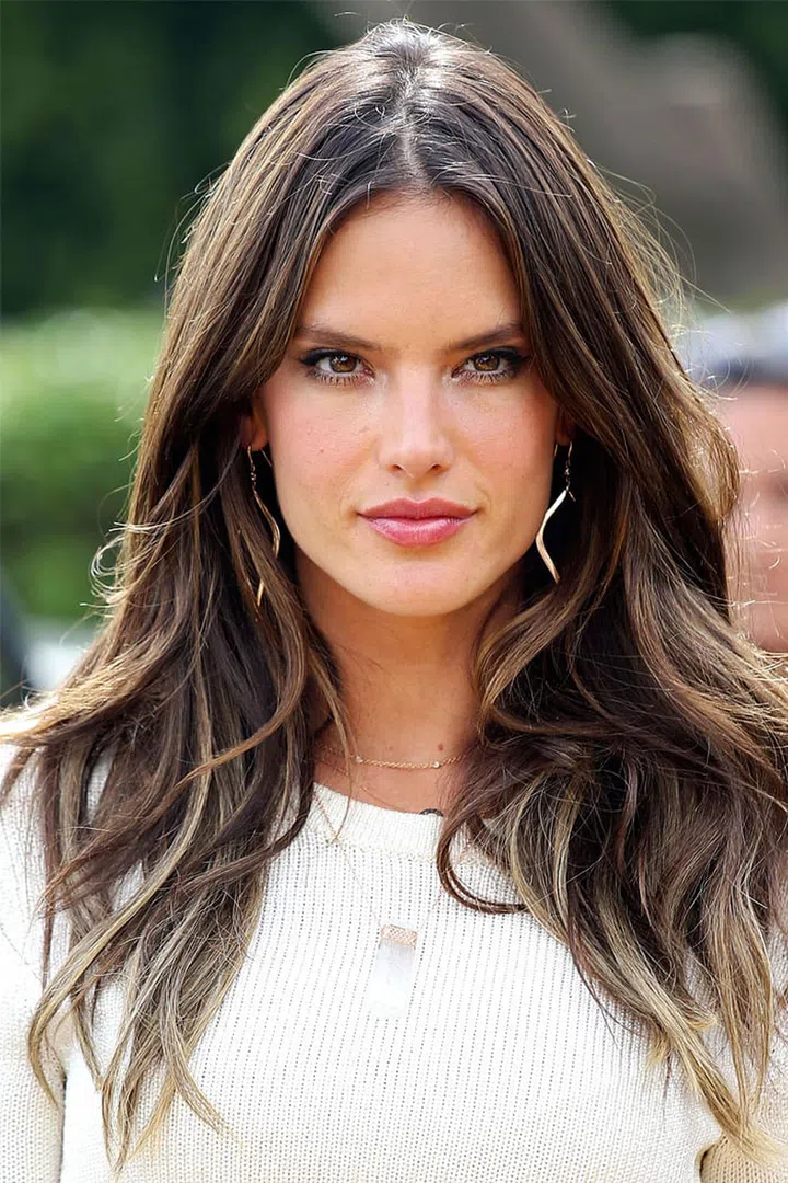 Alessandra Ambrosio proves that high volume hair can be achieved with a deep middle part and a bit of scrunching at the roots.