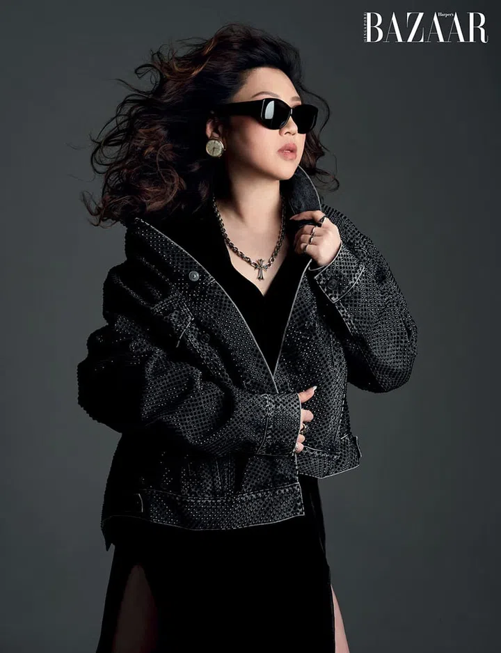Balenciaga jacket; Rick Owens dress; Balenciaga Couture sunglasses and earrings; Chrome Hearts necklace and Chanel rings, her own