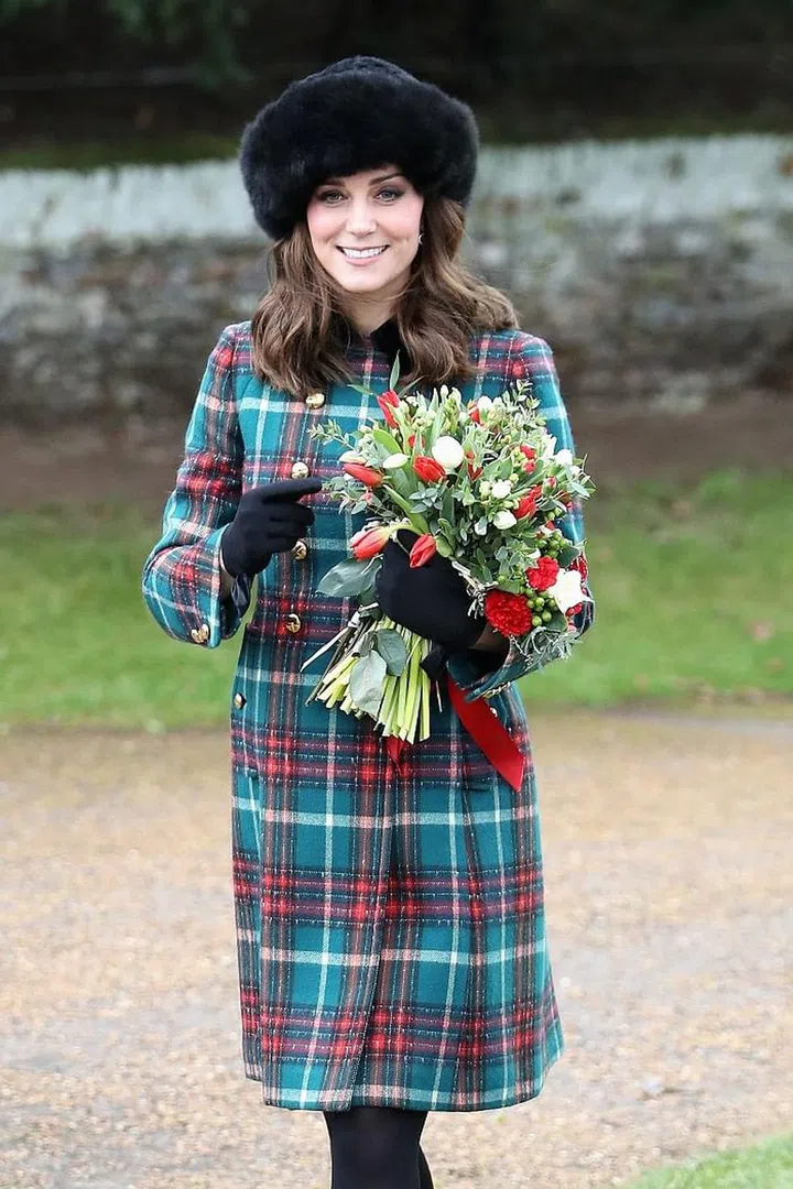 The Duchess of Cambridge was presented with some festive flowers. Photo: Getty 