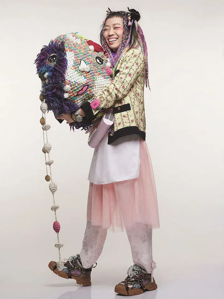 Jacket; sneakers, Gucci. Top; apron; pants; bags; earrings; hair accessories, Lim’s own