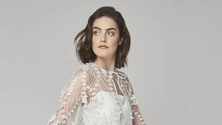 If the spring 2019 bridal shows have taught us anything about hair, it's that you should cut it all off. The bridal lob is bigger than ever, and it makes any gown look a little more modern and cool.