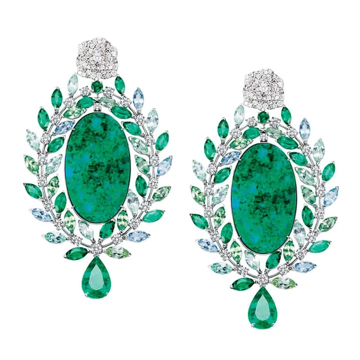 Think wood nymphs and water fairies—this pair of stunning Piaget Rose Passion High Jewellery earrings features unique chrysocolla oval plates surrounded by marquise-cut demantoides, aquamarines, emeralds, tourmalines and diamonds.