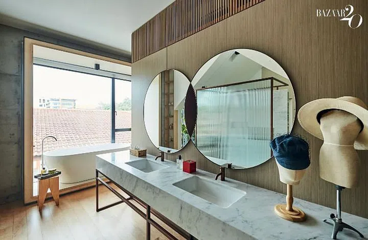 The master bathroom mirror was designed by Chuah and features two interlocking circles inspired by wedding rings.

Photo: Phyllicia Wang