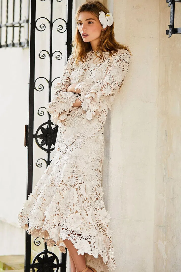 Midi lenghts, high -necklines and statement sleeves work best when done in luxe fabrications. Johanna Oritz "El Lenguaje De Las Flores" dress, $6000, modaoperandi.com. 