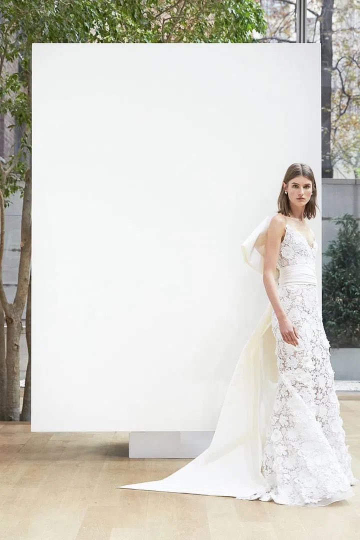 Structured shapes in cotton laces look best for rustic affairs- and girly accents, like oversized bows, feel rights for lush landscapes. Oscar de la Renta "Lola" gown, oscardelarenta.com. 