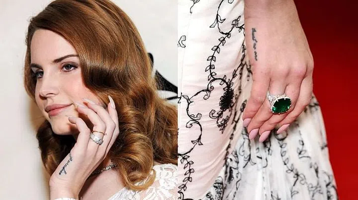The songstress has multiple tattoos, including "trust no one" and "paradise" on the outer sides of her hands and "die young" on the ring finger of her right hand.