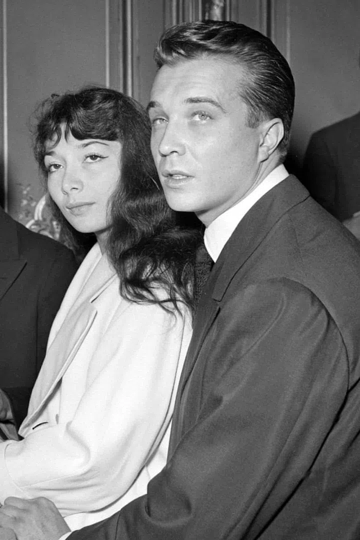 Marrying Philippe Lemaire in 1953. Into the wide lapel, even more into everybody's eye in this. 