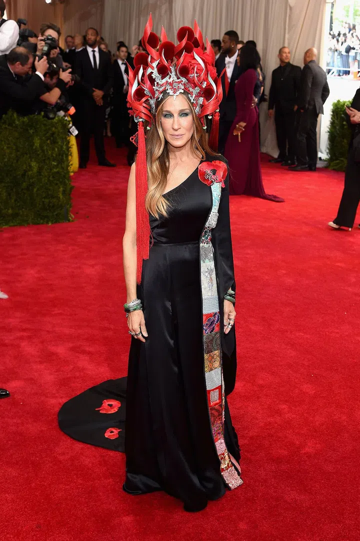 in custom H&M and Phillip Treacy hat