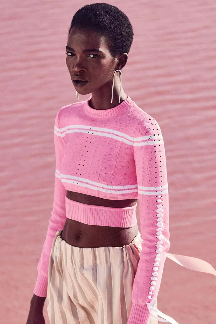 Sweater, skirt, Fendi; earrings, Jennifer Fisher