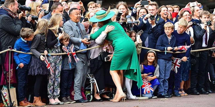 Sarah Ferguson hugs a member of the crowd outside of St. George's Chapel.