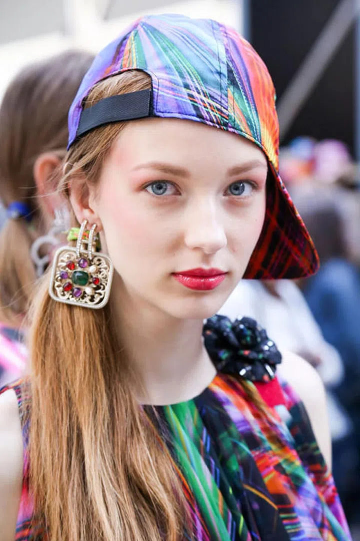 Backstage at Chanel, makeup artists used a combination of the brand's Rouge Allure Velvet Luminous Matte Lip Colour in La Secrète and Rouge Allure Ink Matte Liquid Lip Colour in Séduisant, then topped it with the Chanel Gloss Volume Plumping Lipgloss.