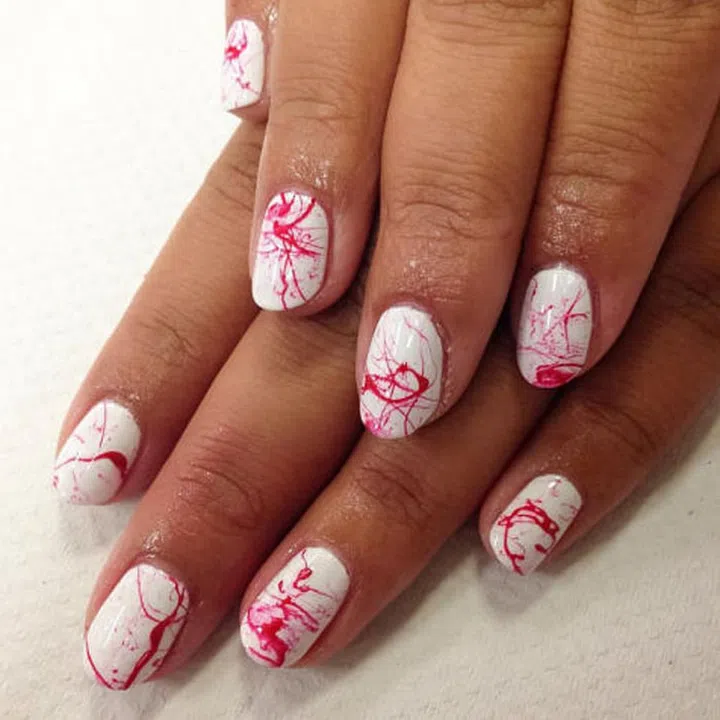Splattered red polish + an antiseptic white base = Dexter nails by Sigourney B. Nuñez (@nailartbysig).