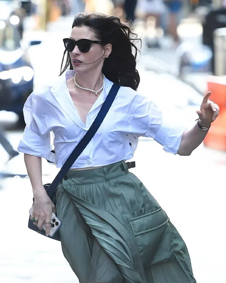 the devil wears prada 2 jewellery and watches | anne hathaway white shirt green skirt behind-the-scenes new york