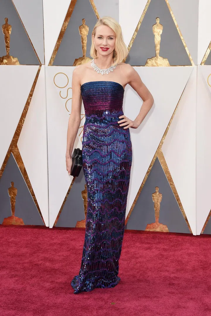 In Armani Privé and Bulgari necklace
