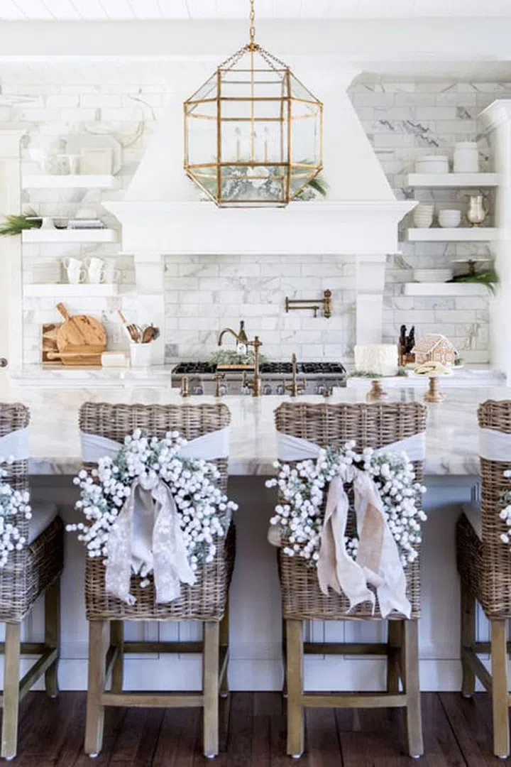 Give your kitchen or dining room chairs a dose of holiday cheer with individual wreaths in winter white.