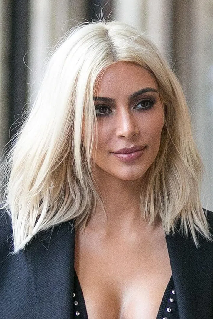 Spritz and go: give straight locks some texture like Kim Kardashian’s with dry shampoo and plenty of sea salt.