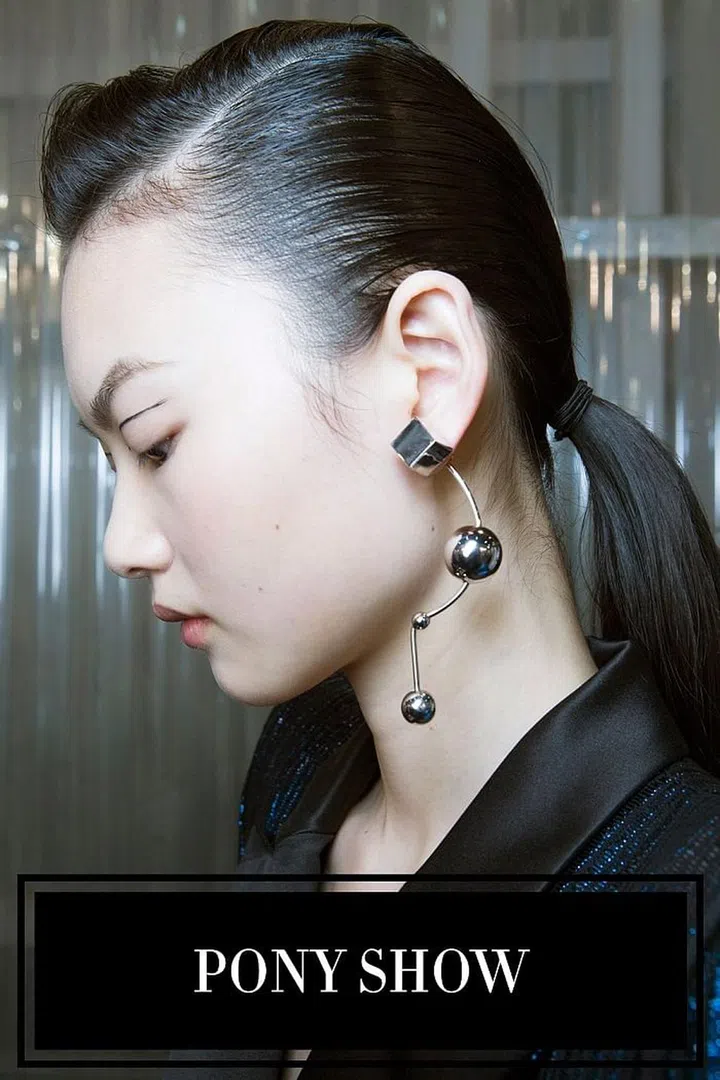 Good news: this season's go-to hairstyle is the ponytail. Doesn't get easier than that, right? But don't think you can get away with just throwing your hair up with an elastic, like you're coming from spin class. The ponytails on the fall runway were thoughtful and chic; the mirror-like shine, sleek parts, and positioning were all meticulously and expertly executed (just look at Thierry Mugler's take, left). This is what your go-to style looks like when it's taken beyond the basics. 
