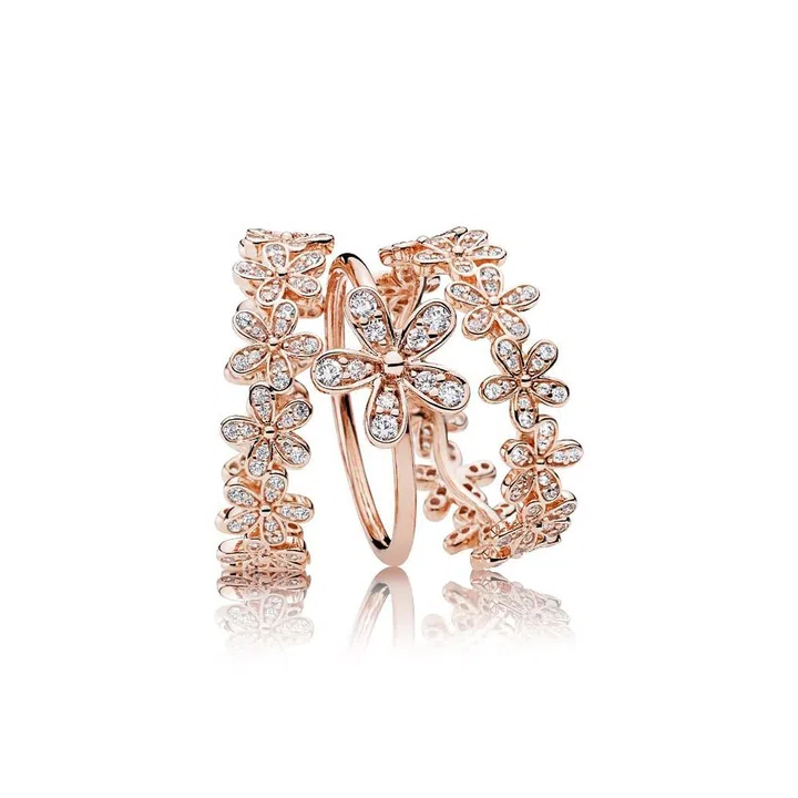 (From left) Dazzling Daisy band ring, $179; Dazzling Daisy ring, $99