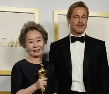 Brad Pitt Brought His Tiny Ponytail To The Oscars