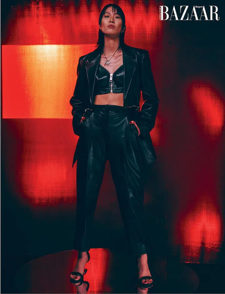 Jacket; bra top; trousers; earrings; necklace; heeled sandals, Alexander McQueen (Photo: Paul McLean)