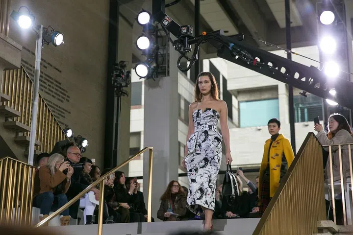 Spotted Bella Hadid wearing a piece from the Michael Kors x David Downton collaboration. Downton's a British artist famous for his elegant fashion illustrations... Photo: Andrea Chong
