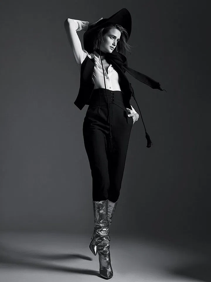 Wool vest; georgette blouse; wool pants; velvet hat; silk scarf; metallic snakeskin boots.