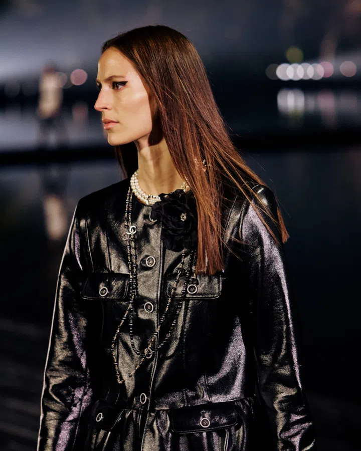 Model in a black outfit Chanel Metiers d’Art 2024/25