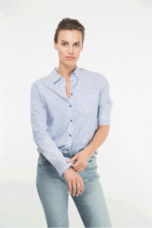 Why: It's less sloppy than a classic rolled sleeve.
How to: Fold sleeve in half and pull to upper arm. Roll the fold up the arm again, stopping right below the sleeve cuff so it sticks out in the chicest way possible.
Equipment shirt, $188, equipmentfr.com, Armani Exchange jeans. Photo: Elizabeth Griffin.