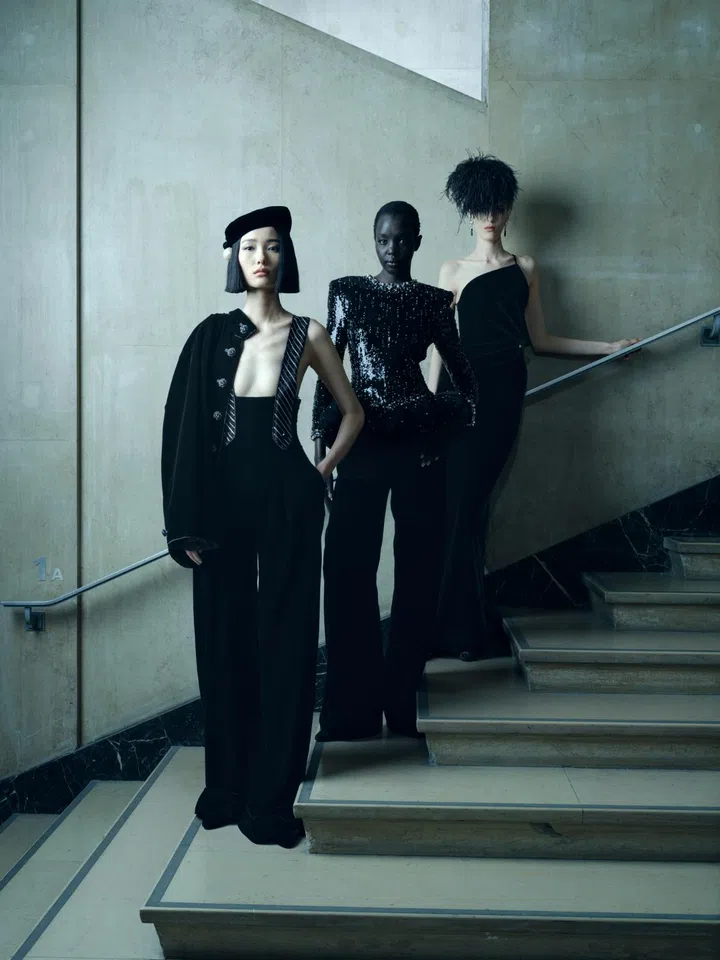 Models wearing Armani Privè shot on a stair case photographed by Christopher Anderson