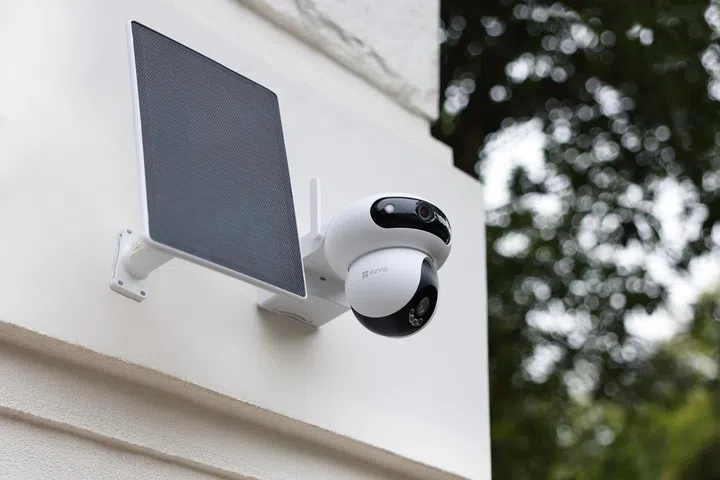 ezviz hb90 dual kit solar-powered dual-lens security camera mounted on an exterior wall