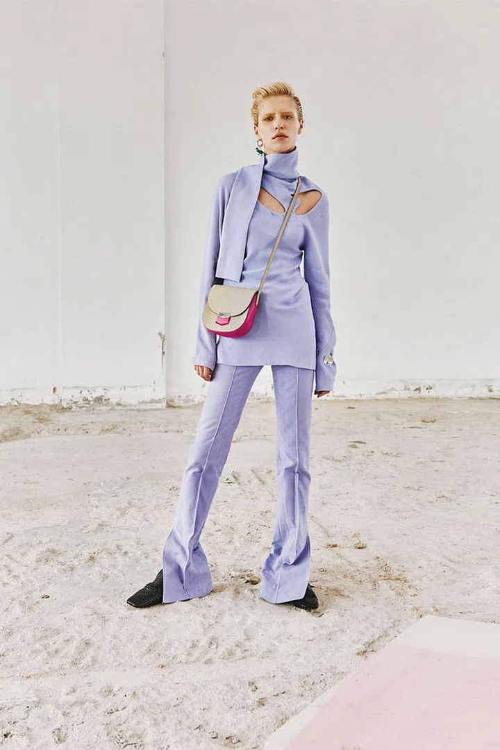 Viscose Double Sable 
top; Viscose Double Sable pants; Dinosaur earring; Magenta Small Baby Grained Calfskin Trotteur 
bag; Silver Petal cuff; Kidskin Woven moccasin, Céline 