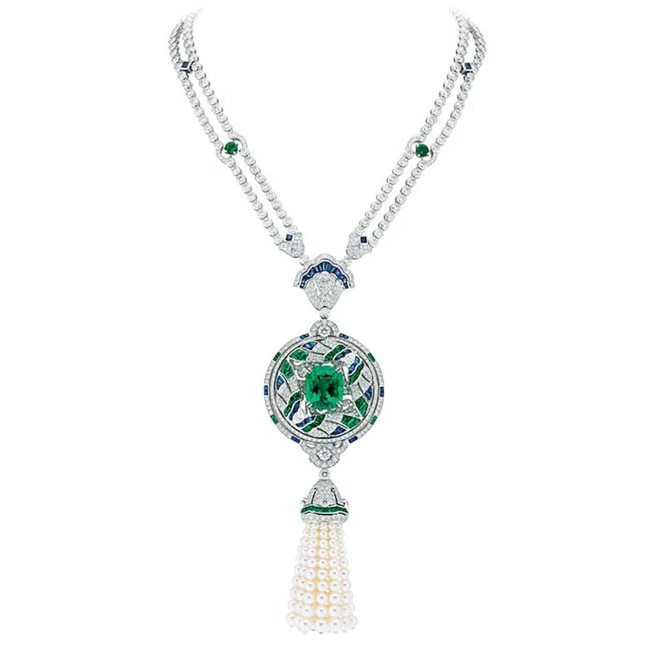 At the heart of Van Cleef & Arpels’ Émeraude en majesté High Jewellery Secret de Papillons necklace is a 16.52 carat Colombian cushion-cut emerald—a stone that has been used throughout history as a talisman. The necklace has detachable tassels of cultured pearls, and the central circular piece can be worn as a brooch.